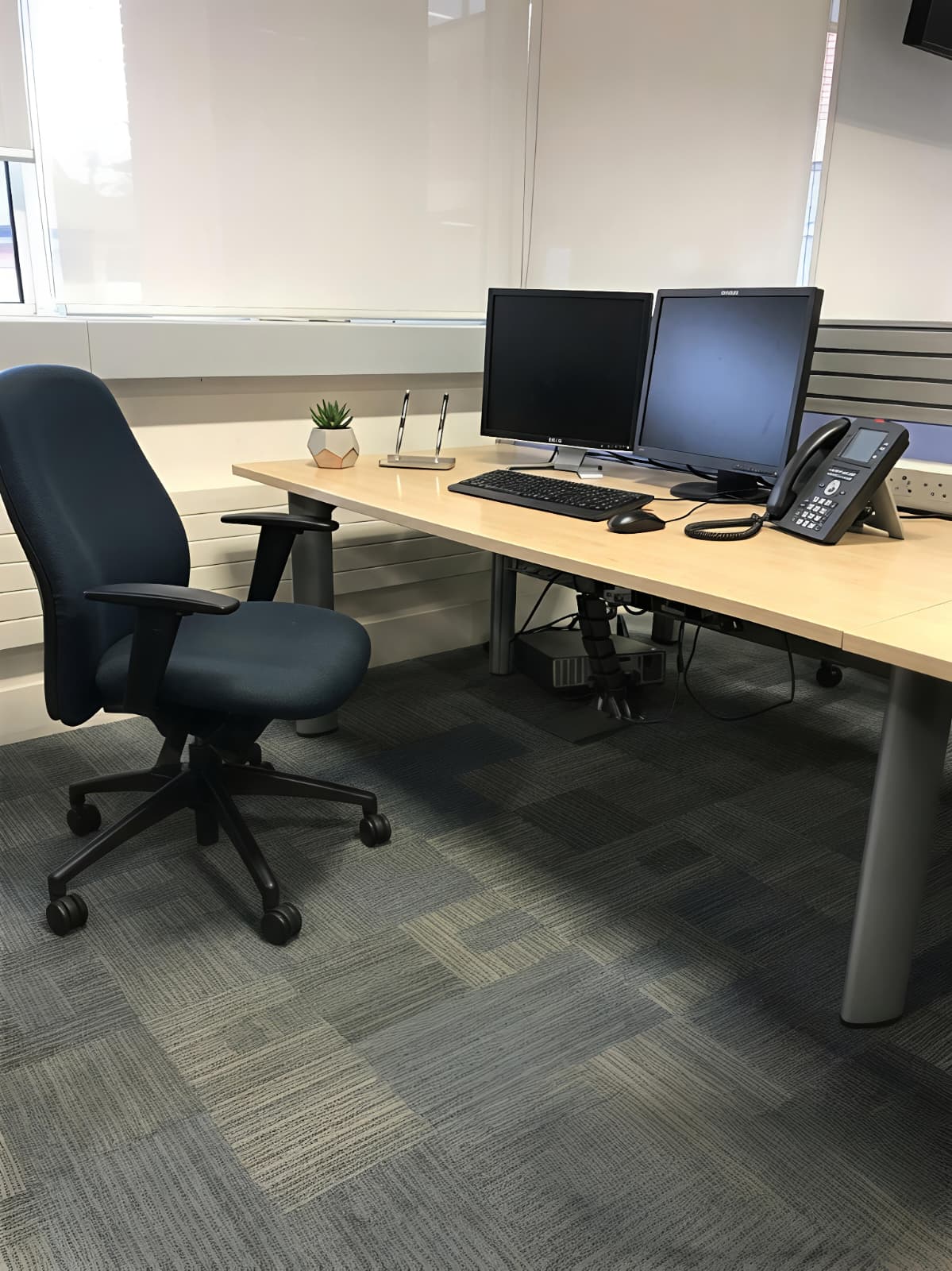 Office after cleaning — tidy, clear desk ready for work